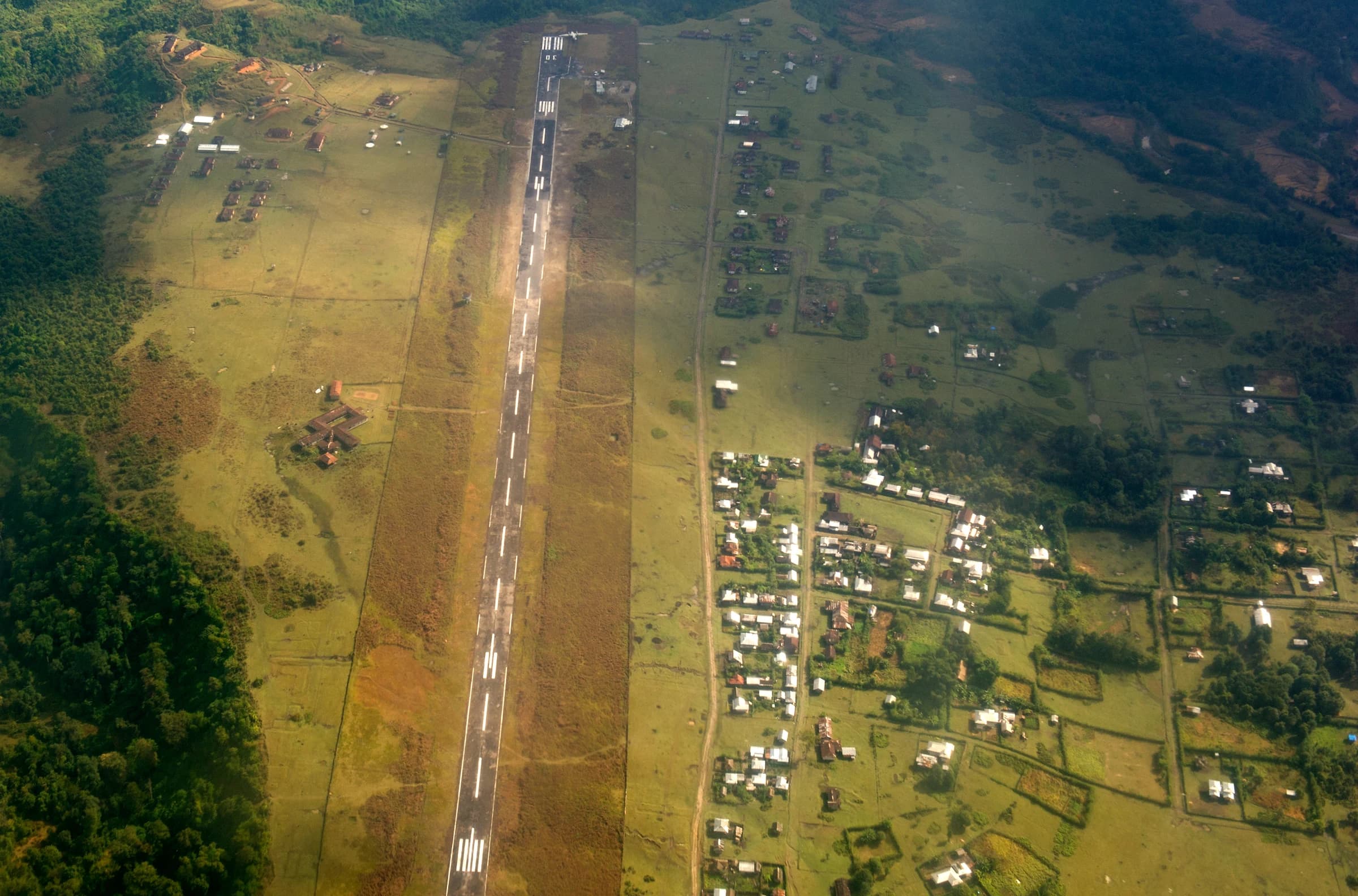 Aerial view of remote Vijaynagar in Arunachal Pradesh, with its airstrip and scattered buildings