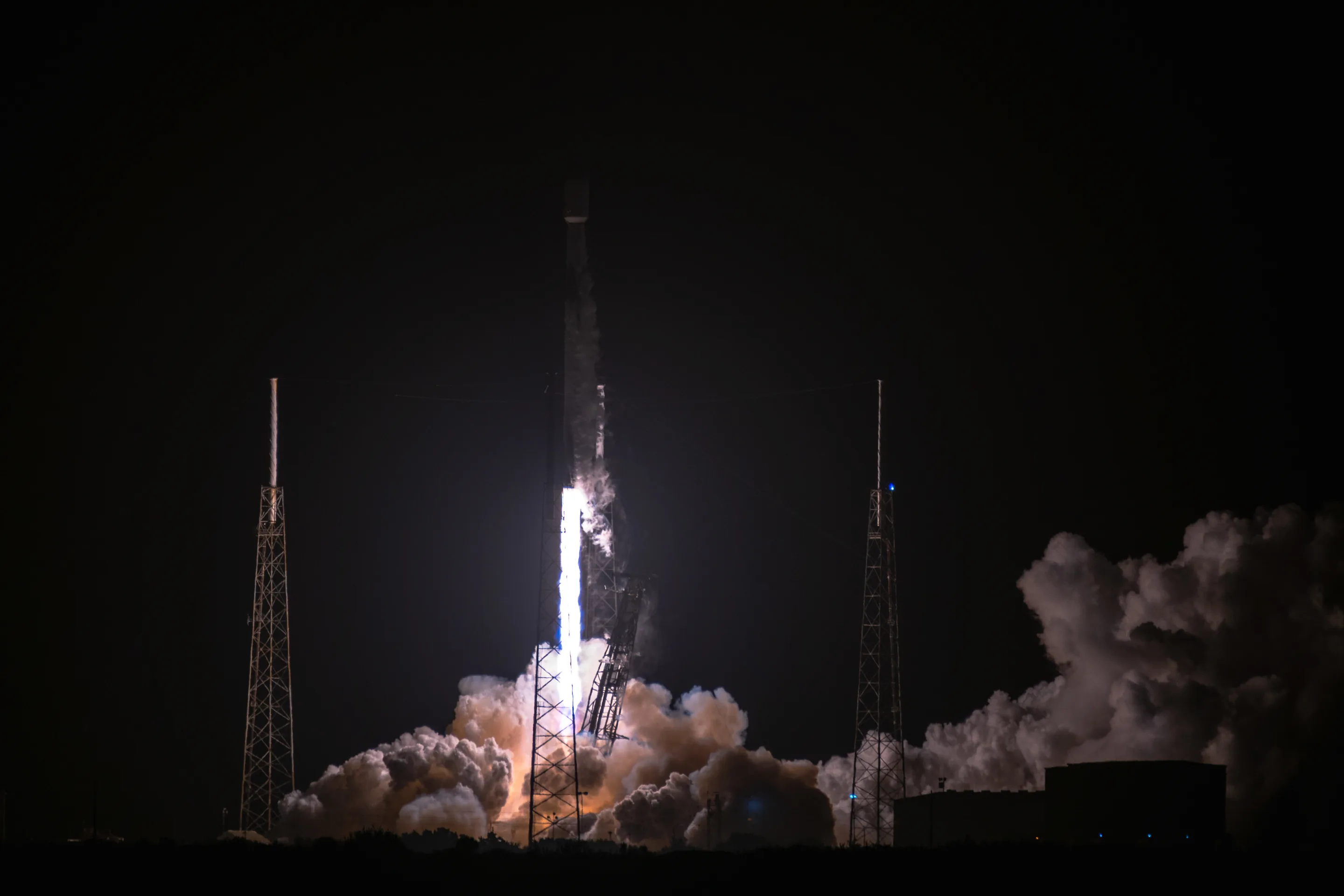 Falcon 9 carrying Japanese company ispace's HAKUTO-R Mission 1 lunar lander lifting off at night